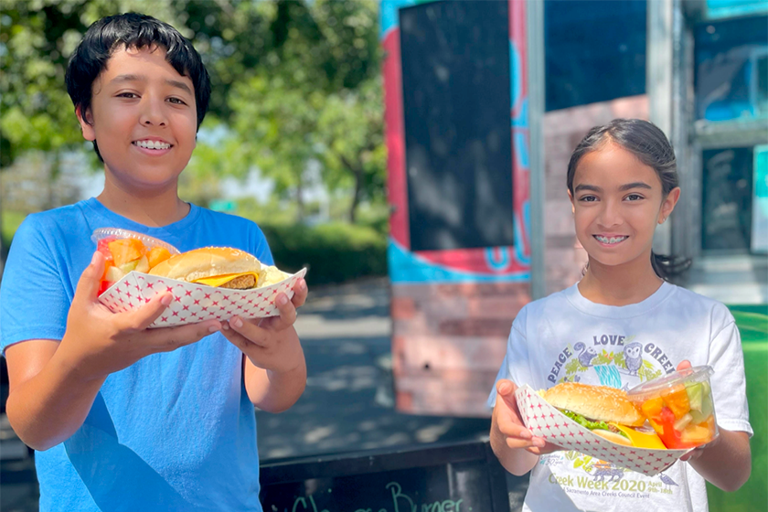 students with meals from food truck