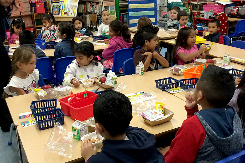 Students enjoy breakfast in the classroom