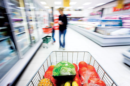 working mom shopping in supermarket
