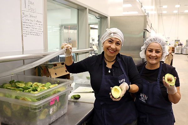 Staff prepare avocados for guacamole