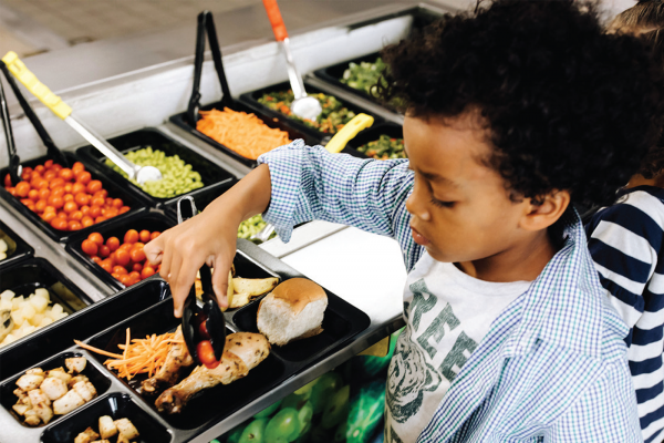Child at school salad bar