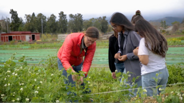 educator and students in the farm
