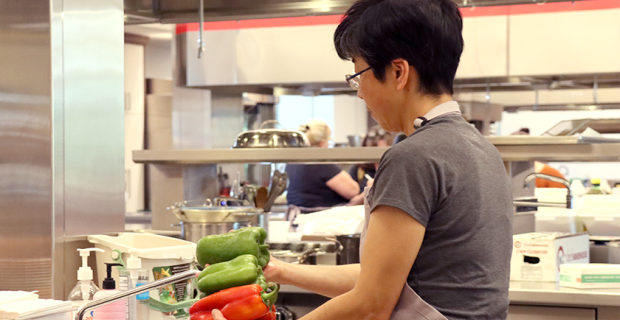 woman washing peppers