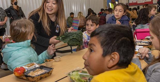 Jennifer Lew Vang with students at lunch table