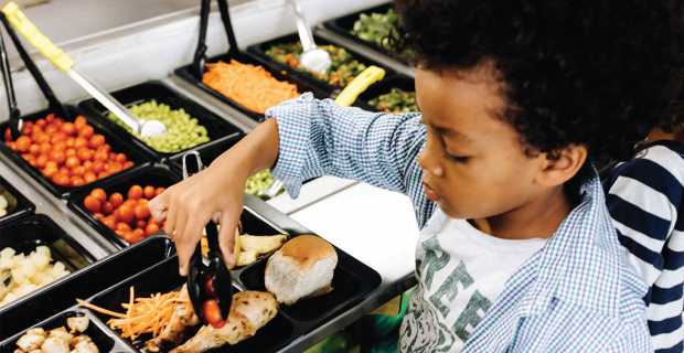 Child at school salad bar